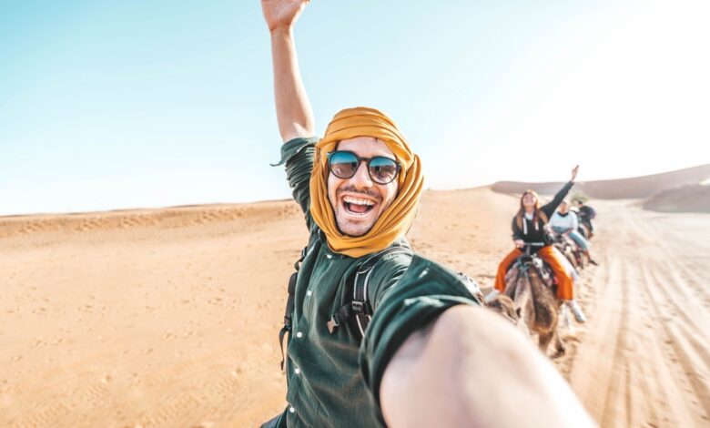 Happy,Tourist,Having,Fun,Enjoying,Group,Camel,Ride,Tour,In