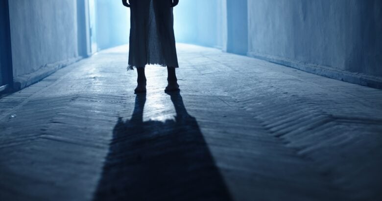 Low,Angle,Shot,Of,Legs,Of,Little,Girl,Ghost,Slowly
