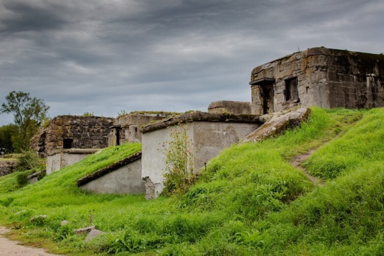 Abandoned,World,War,Ii,Bunkers,With,Overgrown,Grass,And,Cloudy