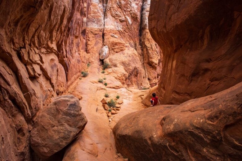 A,Young,Hiker,Explores,The,Rugged,Fiery,Furnace,Trail,In