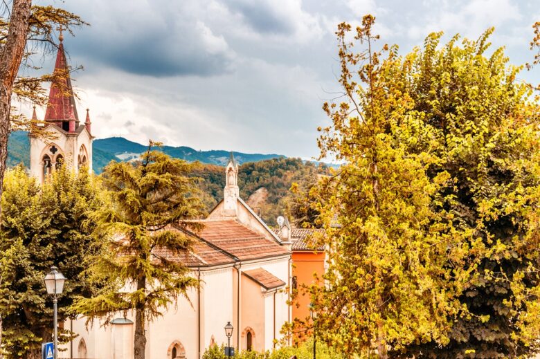 Red,Roofs,And,Grunge,Walls,Of,Ancient,Buildings,And,Belfry