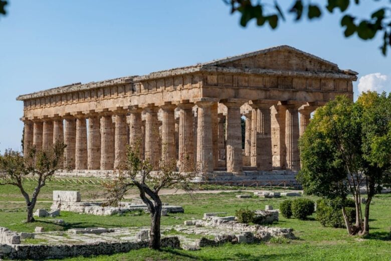 Stunning view of the ancient Temple of Hera in Paestum, Italy, with clear skies.