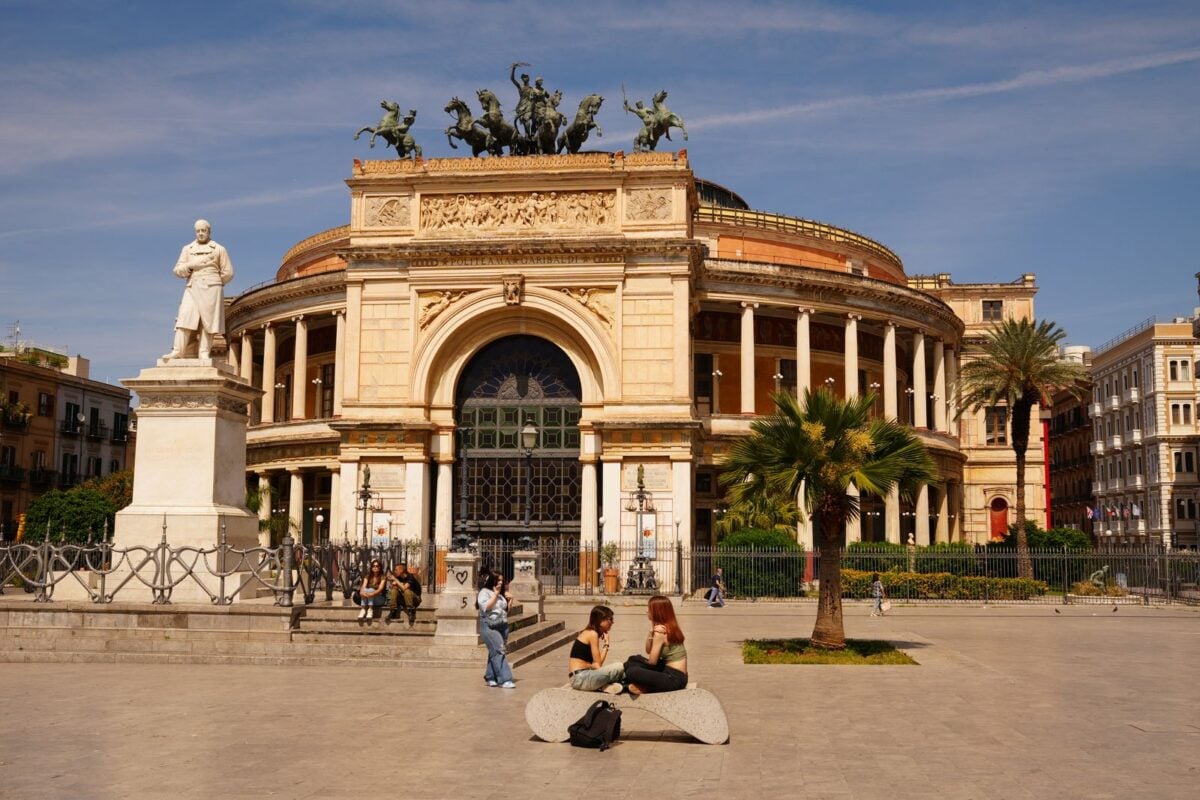 View of Teatro Politeama in Palermo, Sicily with people enjoying a sunny day. View of Teatro Politeama in Palermo, Sicily with people enjoying a sunny day.
