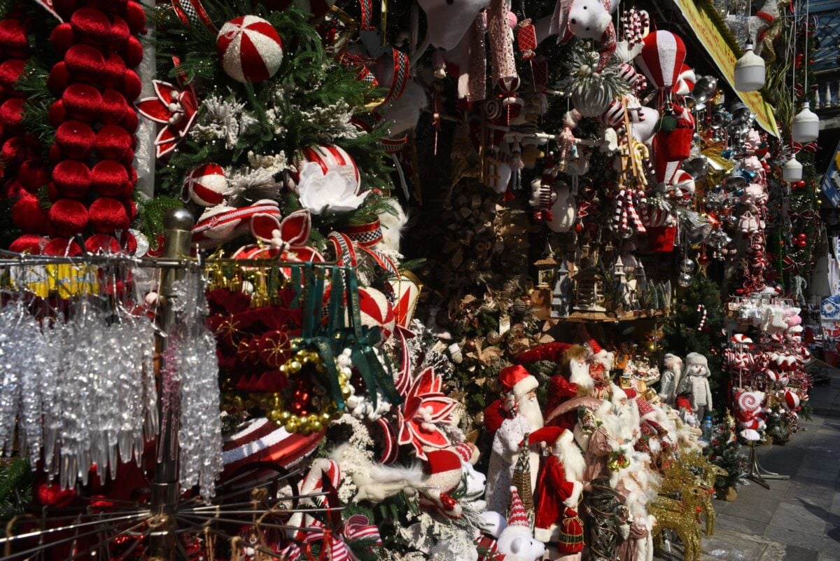 Colorful Christmas market display with festive decorations and ornaments, perfect for holiday inspiration.